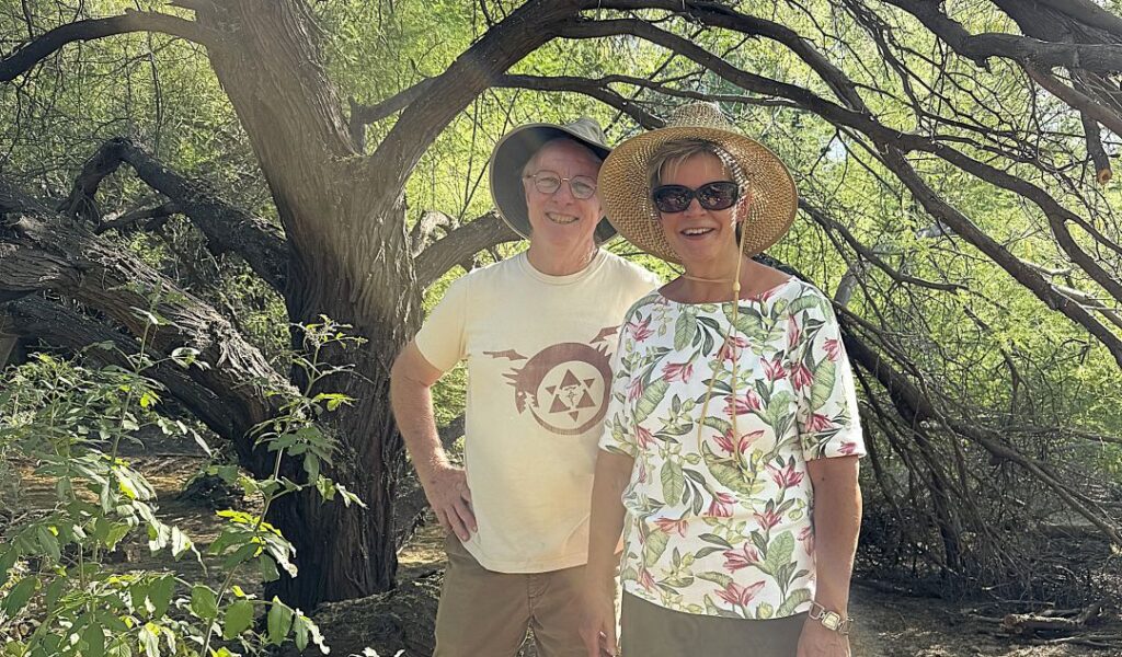 Matthew Chew and Kelly Duffin standing in Chew's wild garden
